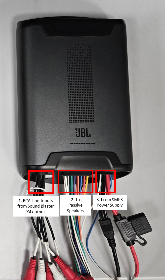 A black box with wires connected to it Description automatically generated